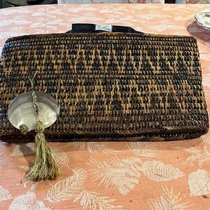Mister Ernest Woven Brown Straw Clutch with Shell Tassel